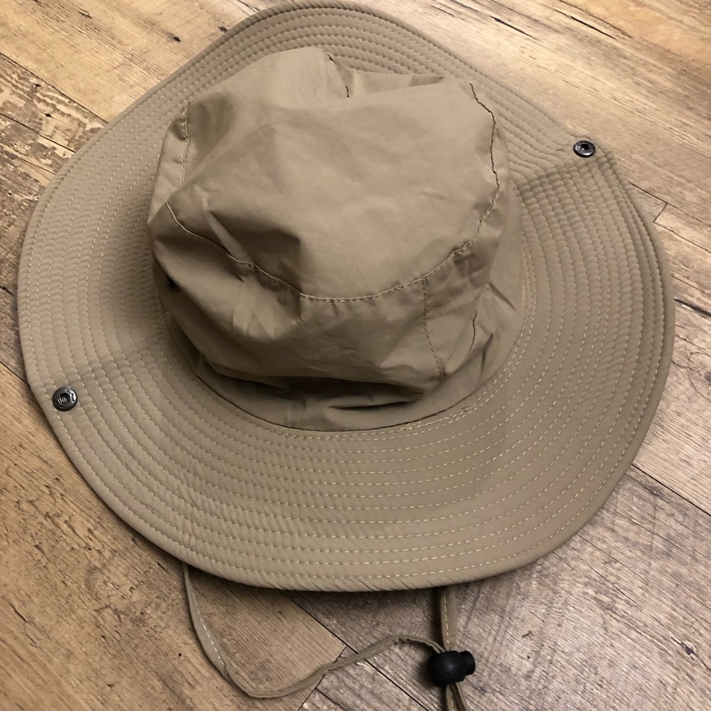 Tan outdoorsman hat.